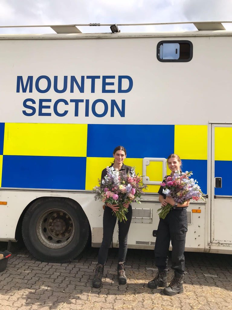 local police enjoying donated flowers 