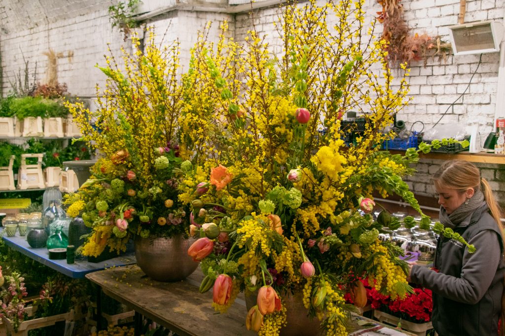 warehouse event yellow floral designs 