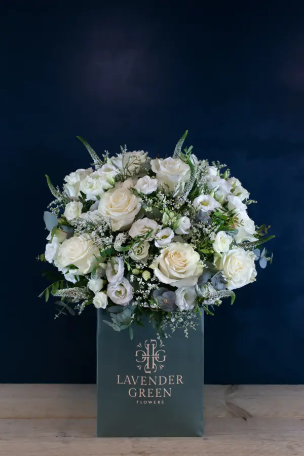 Graduation Bouquet - Roses, Lisianthus, Limonium and Veronica with mixed seasonal foliage